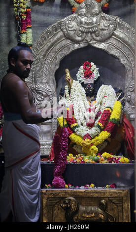 Sri Veeramakaliamman Hindu Temple. Hindu God : Veeramakaliamman. Hindu Brahmin priest.   Singapore. Stock Photo