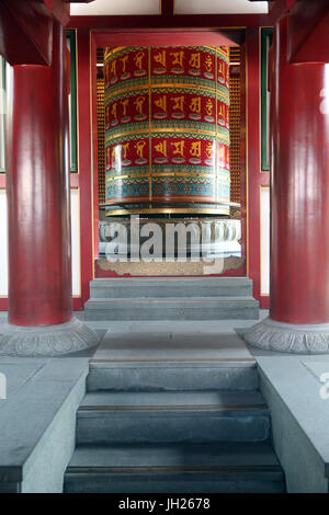 Buddha Tooth Relic Temple in Chinatown. Viarocana Buddha prayer wheel.  Singapore.