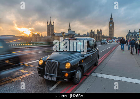 Sunset over a taxi and Big Ben on Westminster Bridge, London, England, United Kingdom, Europe Stock Photo