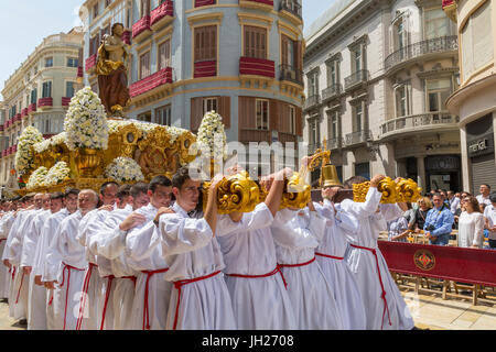 Locals taking part in the Resurrection Parade on Easter Sunday, Malaga, Costa del Sol, Andalusia, Spain, Europe Stock Photo