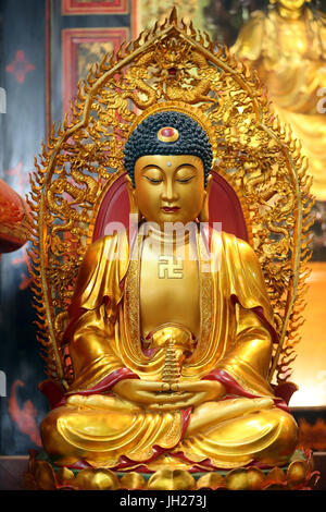 Leong San buddhist temple.   Golden Buddha statue.  Singapore. Stock Photo