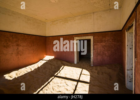 Sand in an old colonial house, old diamond ghost town, Kolmanskop (Coleman's Hill), near Luderitz, Namibia, Africa Stock Photo