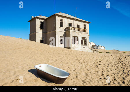 Bathtub standing in the desert, old diamond ghost town, Kolmanskop (Coleman's Hill), near Luderitz, Namibia, Africa Stock Photo