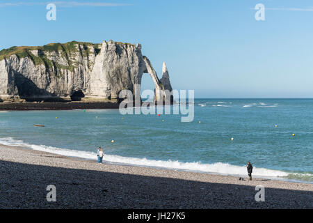 People on the beach and Porte d'Aval in the background, Etretat, Normandy, France, Europe Stock Photo