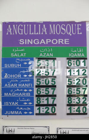 Clocks showing the time all prayers Muslims.Salat.  Singapore. Stock Photo