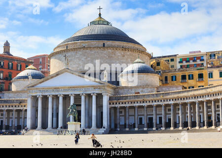 Pigeons and people in the Piazza del Plebiscito with the Basilica di San Francesco di Paola, City of Naples, Campania, Italy Stock Photo