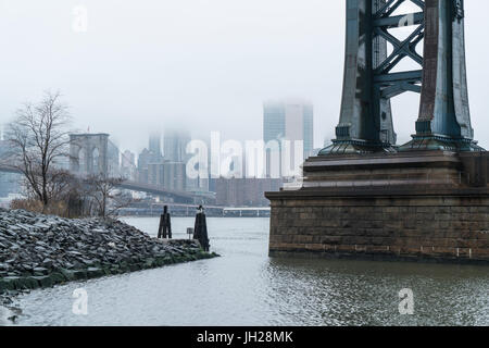 Manhattan Bridge on a cold foggy day, Brooklyn Bridge and skyline beyond, New York City, United States of America, North America