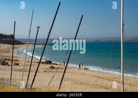 Beach seen though masts of beached boats, Mossel Bay, Western Cape, South Africa, Africa Stock Photo