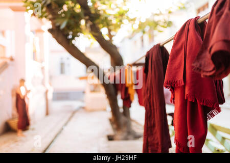 Buddhist monks' robes hanging to dry, Amarapura, Mandalay, Mandalay Region, Myanmar (Burma), Asia Stock Photo