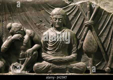 The Victoria and Albert Museum. Part of a relief of the Buddha's death (parinirvana). 200-400. Kushan period. Schist. Gandhara/Northwest Pakistan. Uni Stock Photo