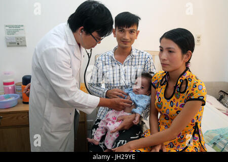 Tam Duc Heart Hospital.  Doctor listening to young girl's heart.  Ho Chi Minh City. Vietnam. Stock Photo