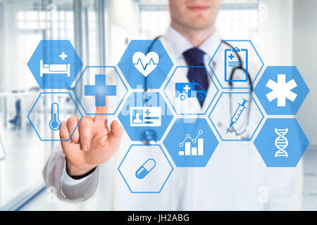 Medical doctor touching icons of health care services on a digital screen, with hospital interior background Stock Photo