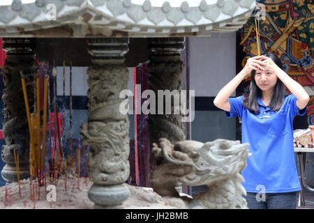 Taoist temple. Nghia An Hoi Quan pagoda.  Dragon sculpture.  Ho Chi Minh City. Vietnam. Stock Photo