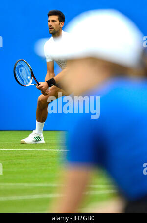 Novak Djokovic (Serbia) behind a ball girl on centre court at Devonshire Park, Eastbourne, during the Aegon International tournament, 28th June 2017 Stock Photo