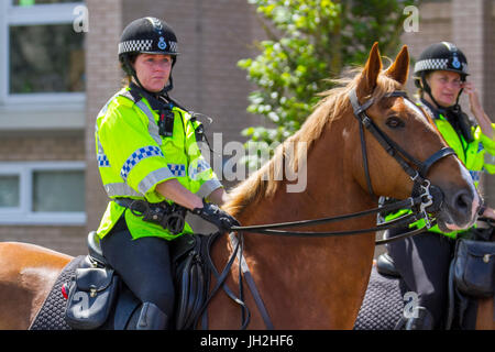 Mounted policewoman on horseback in Southport, Merseyside, UK. 12th July, 2017. Celebrations. Bright sunshine for Orangemen's Parade. Credit: MediaWorldImages/Alamy Live News Stock Photo