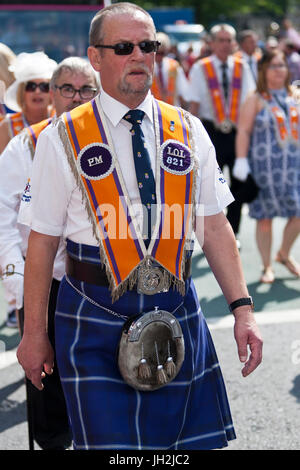 Belfast, UK. 12th Jul, 2017. Orangemen and women celebrate 12th July Battle of the Boyne in Belfast, Northern Ireland on the 12th July 2017.   Over Seventy (70) bands and hundreds of people took to the streets of Belfast as part of the Annual 12th July Battle of the Boyne Celebration. This is where Protestant King William of Orange defeated Catholic King James II      Credit: Bonzo/Alamy Live News Stock Photo