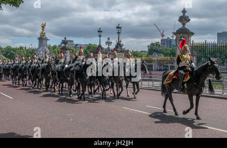 Constitution Hill, London, UK. 12th July, 2017. Mounted troops of the Blues and Royals ride up Constitution Hill back to stables and barracks after the Spanish Royal Family arrive at Buckingham Palace for the State Visit. Credit: Malcolm Park/Alamy Live News. Stock Photo