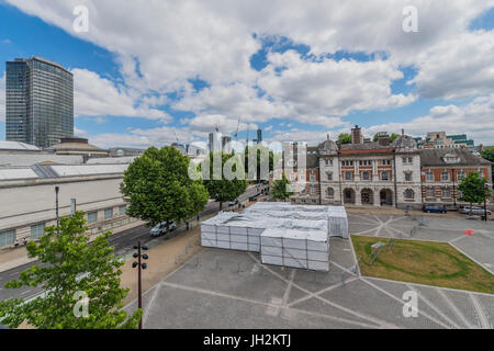 London, UK. 12th July, 2017. The outside of Cosmic Latte Lullaby a new installation by Sally Buchanan as part of The Chelsea College of Arts Summer FLUX exhibition on the Rootstein Hopkins Parade Ground, which faces the Tate Britain in Millbank. The space is home to an artificial observatory, an installation christened with the name of the colour of the universe - a 14 x 14 metre viewing chamber constructed with scaffolding and a double sided space blanket. Credit: Guy Bell/Alamy Live News Stock Photo