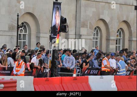 London, UK.  12 July 2017.  Crowds watch the parade of Formula One cars taking place around a circuit passing Trafalgar Square and Whitehall during a promotional event called F1LiveLondon ahead of the British Grand Prix at Silverstone.   Credit: Stephen Chung / Alamy Live News Stock Photo