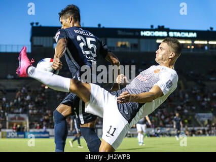 Jacksonville, FL, USA. 12th July, 2017. : Armada's Bryam Rebellon (25), left, and Puerto Rico's Giuseppe Gentile (11) vie for the ball during the first half of NASL pro soccer action in Jacksonville, FL, Wednesday, July 12, 2017. Gary McCullough/CSM/Alamy Live News Stock Photo