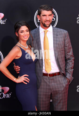 (L-R) Wife Nicole Johnson, Michael Phelps, and Son Beckett Richard