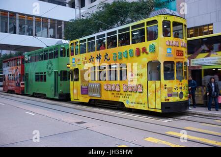 Colorful trams on the streets of Hong Kong Island in Hong Kong, China. Stock Photo