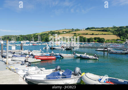 Numerous inflatable dinghies tied up on pontoons in Salcombe, Devon Stock Photo
