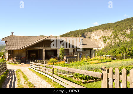 Wooden farmhouse with a vegetable garden in Alto Adige on the South Tyrol in Italy Stock Photo