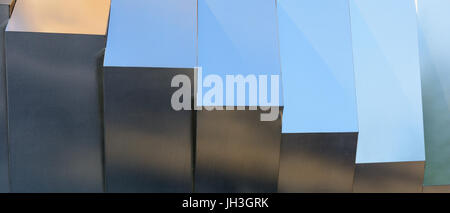 Light reflections on silver grey metallic surface with fine texture. Stock Photo