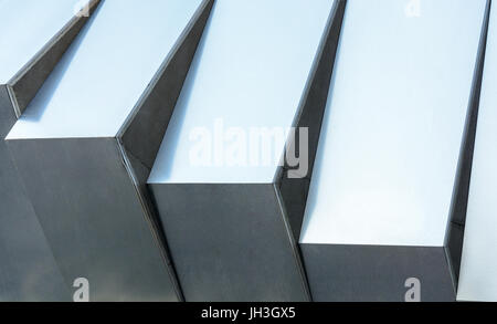 Light reflections on silver grey metallic surface with fine texture. Stock Photo