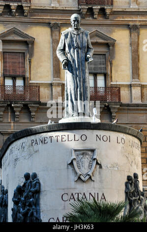 A bronze statue of Saint Francis of Assisi  in front of The Church of Saint Francis of Assisi, Catania, Sicily. Stock Photo