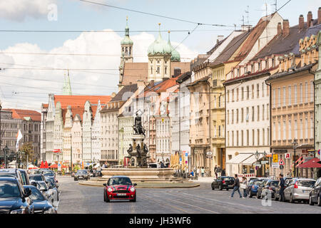 AUGSBURG, GERMANY - MAY 20: People and cars on a street in Augsburg, Germany on May 20, 2017. Augsburg is one of the oldest cities of Germany. Foto ta Stock Photo