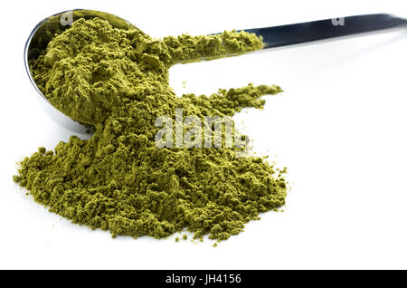 Heap of green matcha tea isolated on white background Stock Photo