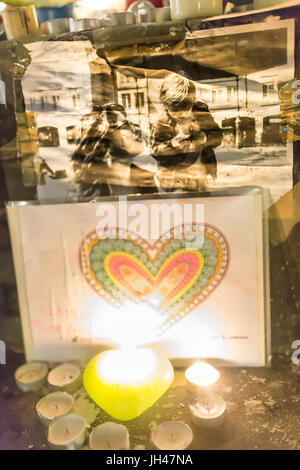 heart drawing and photo of victim in the glimmer of a candle. Homage at the victims of the terrorist attacks in Paris the 13th of november 2015: Stock Photo