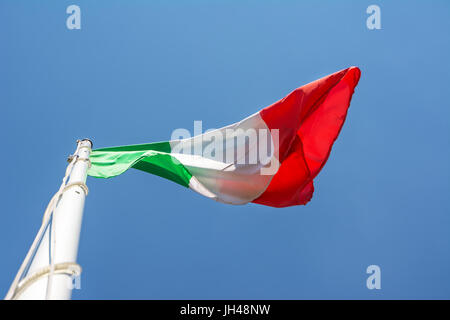 The Italian flag in blue sky Stock Photo