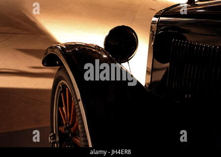 night, retro car moves with headlights, side view Stock Photo