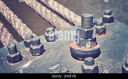 Close up of a bridge construction details, industrial background, color toning applied. Stock Photo