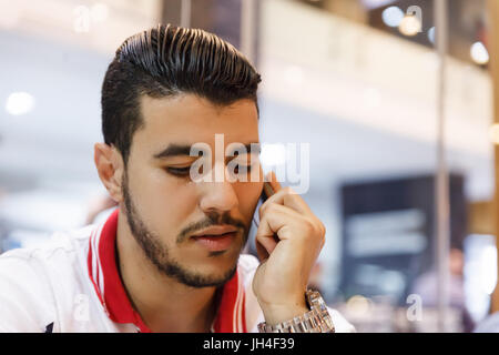 Handsome arabian man with smartphone Stock Photo