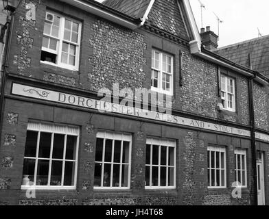 Black and white image of old Dorchester Ales & Stouts public house signage in Winchester, Hampshire, England, UK Stock Photo