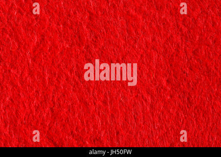 Abstract background with red felt texture, velvet fabric. Stock Photo