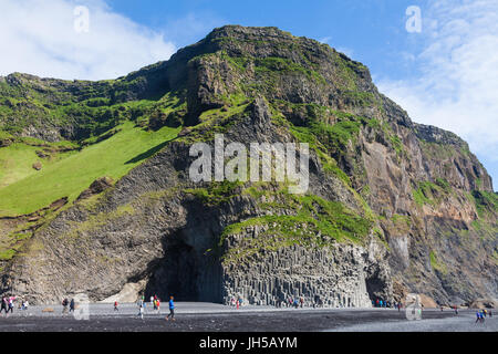 Sea cave and basalt columns on the black sand beach at Reynisfjara in Iceland Stock Photo