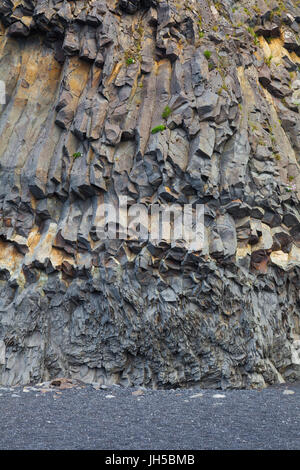 Exposed basalt formations on the Reynisfjara black sand beach in Iceland Stock Photo