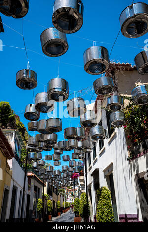 Unusual Street Decorations in including washing machine drums in Camara de Lobos  a fishing village near the city of Funchal Madeira Stock Photo