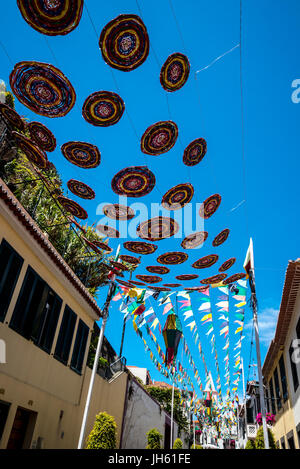 Unusual Street Decorations in including washing machine drums in Camara de Lobos  a fishing village near the city of Funchal Madeira Stock Photo