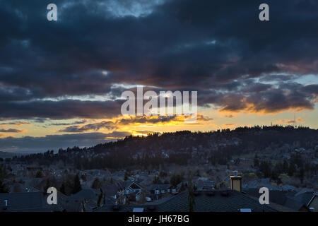 Stormy sky over Happy Valley Oregon residential suburban neighborhood during sunset Stock Photo