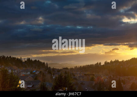 Storm Clouds over Happy Valley Oregon residential suburban neighborhood during sunset Stock Photo