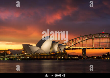 Sydney Opera House illuminated at sunset Stock Photo