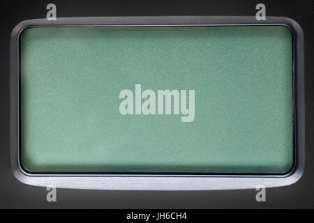 Green LCD screen in black plastic frame. Template, texture and background Stock Photo