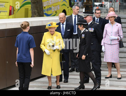 Queen Elizabeth II and the Duke of Edinburgh leave after opening the new Metropolitan Police headquarters, New Scotland Yard on Victoria Embankment in London. Stock Photo
