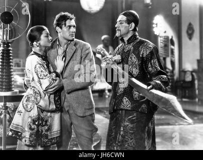 THE MASK OF FU MANCHU 1932 MGM film with from left: Myrna Loy, Charles Starrett, Boris Karloff Stock Photo